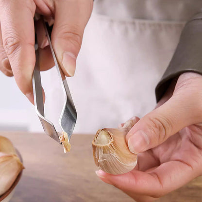 🎉[Kreativ present]🎁Högkvalitativa 304 rostfria stålklämmor för att skala vitlök i köket💥Köp 2 få 3 gratis tidsbegränsat erbjudande